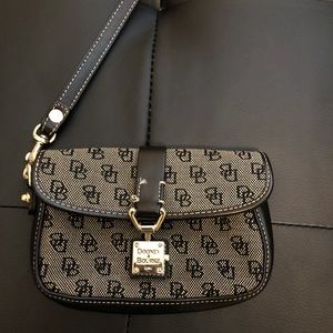 Dooney & Bourke flap wristlet. Black/Gold buckle